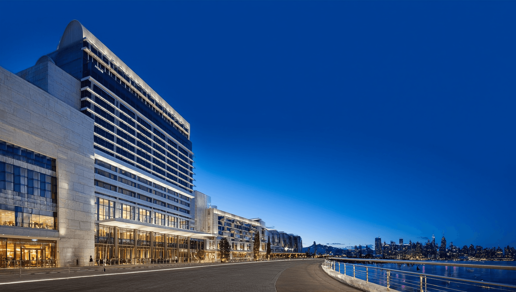 Lucky Seacrestvale Resort & Casino tower from the promenade at blue hour